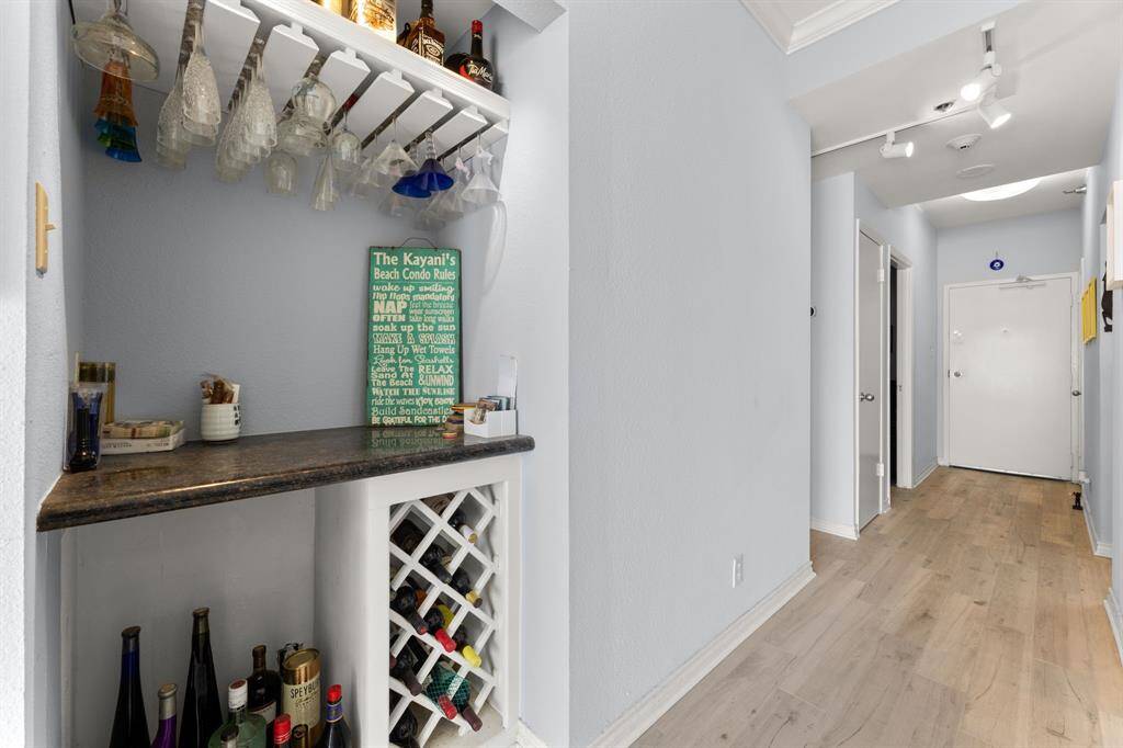 Large foyer with coat closet - Enjoy entertaining with this Bar with great storage for wine bottles and glasses