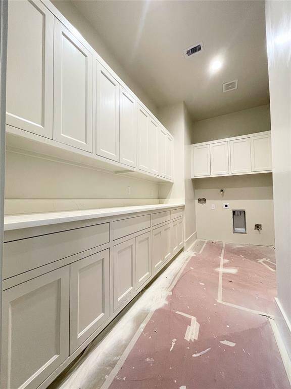 Laundry Room off the Primary Bedroom and upstairs Game Room. Photo Update 2/10/25