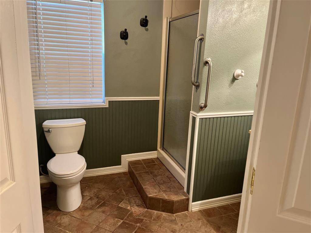 Main Quarters - Bath with step up shower. Handicap railing for assitance.