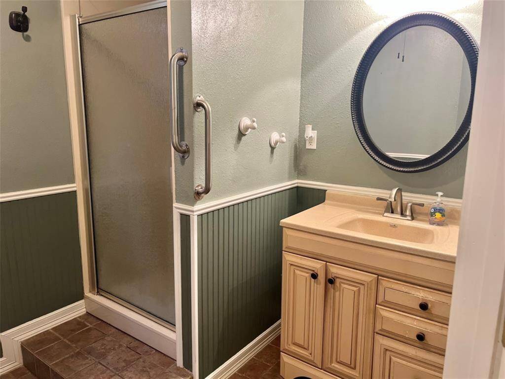 View of vanity and shower in the main living quarters.