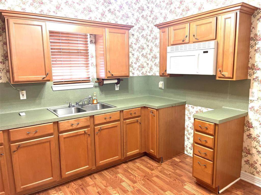 Full secondary kitchen in rear of the home with separate entrance from back.
