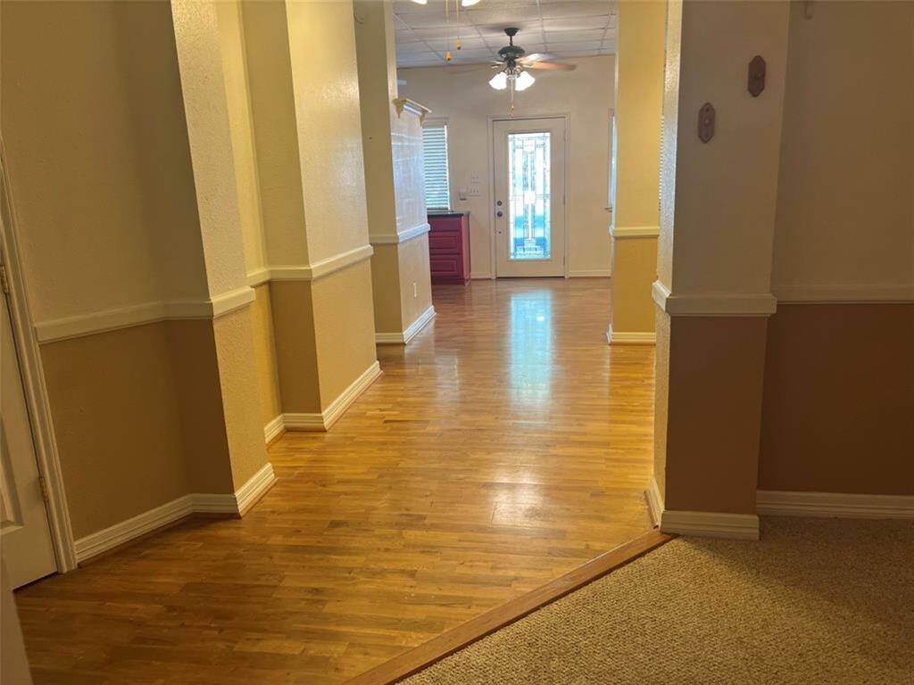 View from the primary bedroom to the front  living room area.