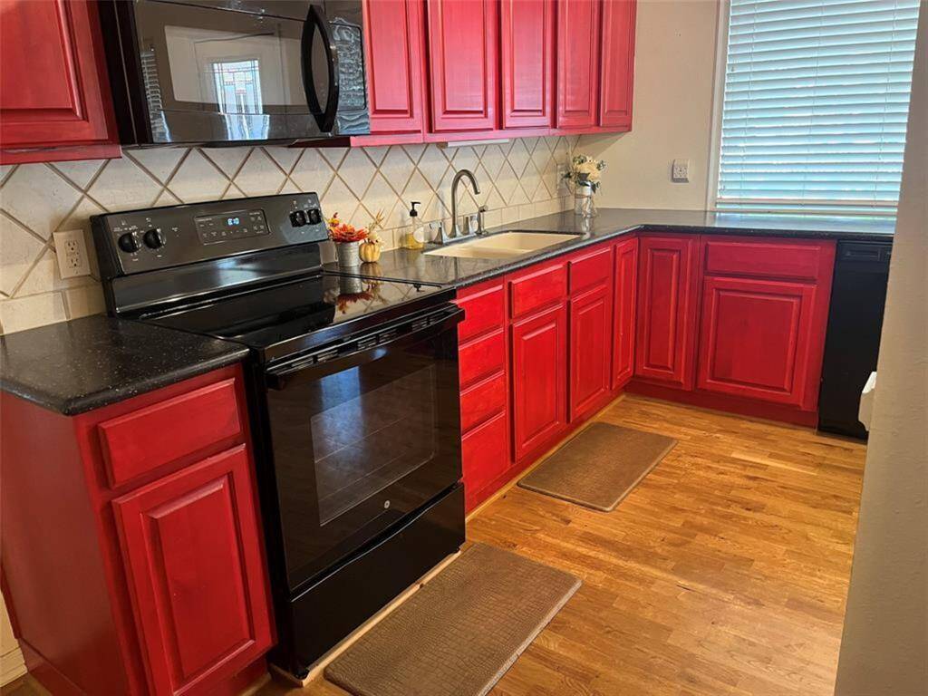 Main kitchen in front.  One of two full kitchens