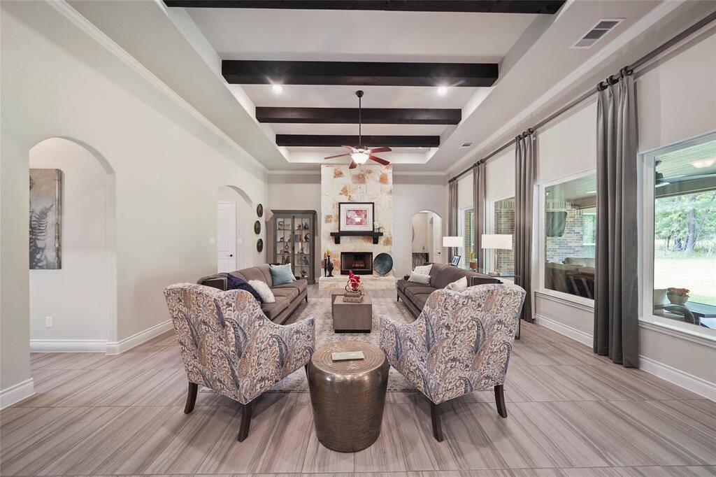 Welcome home! Wall of windows with views of the covered patio and beyond.