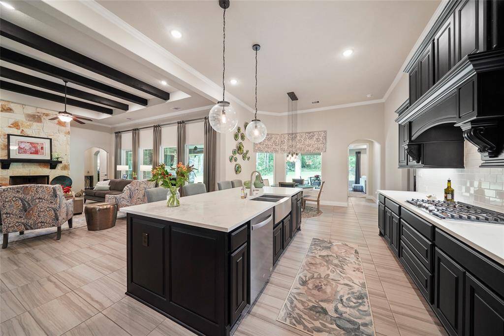 The large center island is the centerpiece of this kitchen.