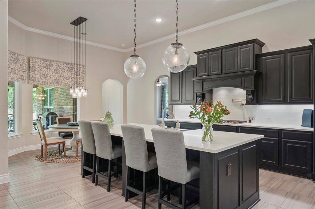 You will enjoy entertaining guests or visiting with family while preparing meals. Beautiful custom cabinetry provides abundant storage.