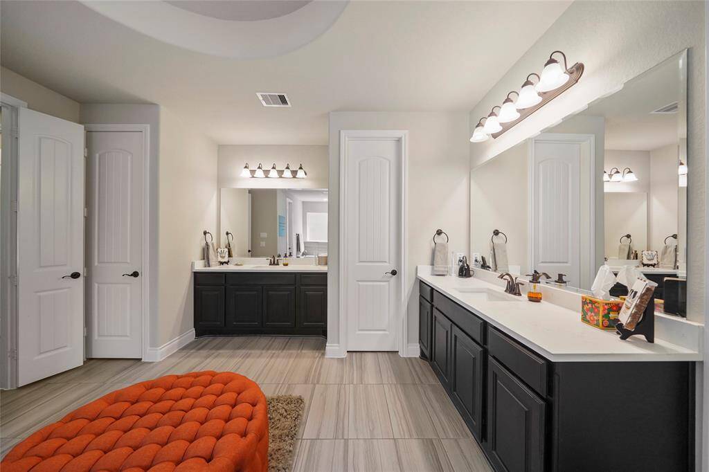 So much space! His and her vanities and separate walk-in closets.