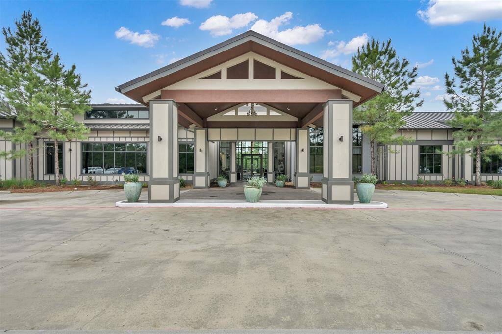 Large Covered Patio off Sunroom in the back of home