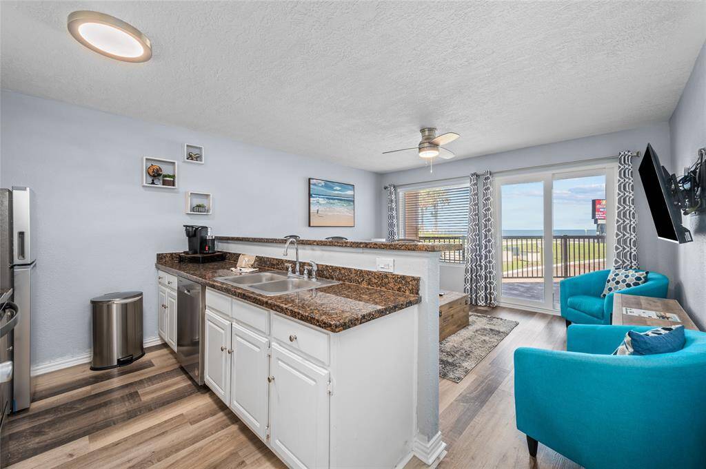 Den and kitchen are combined.