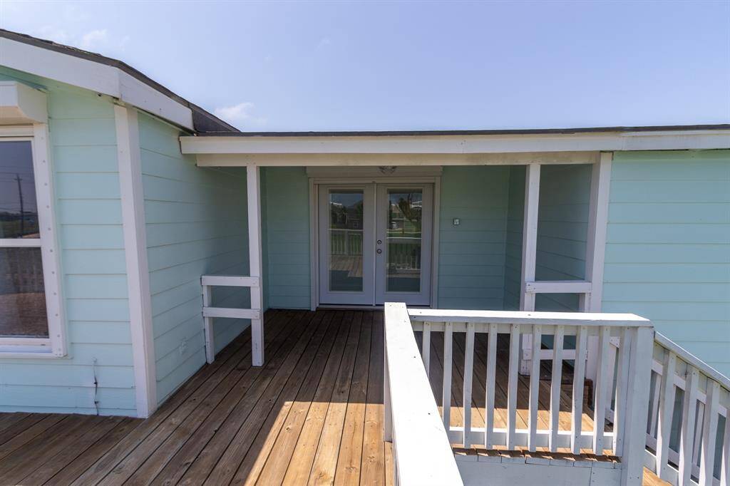 Enjoy your morning coffee in this spacious, shaded sitting area, perfect for relaxing away from the sun.
