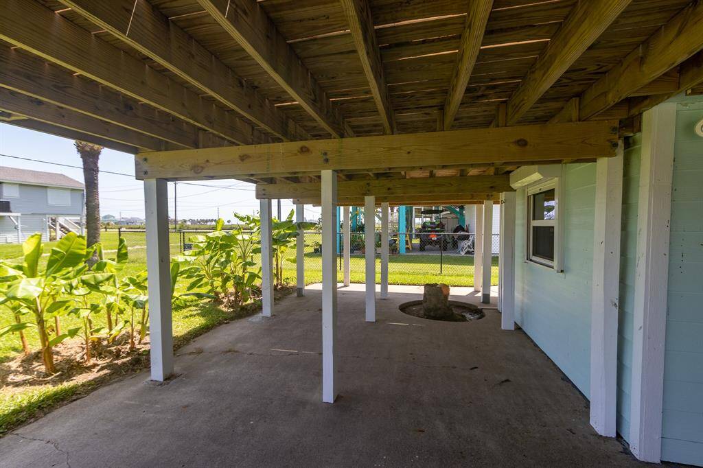 Enjoy the versatile covered space perfect for entertaining, gardening, or relaxing in the refreshing Gulf breeze.