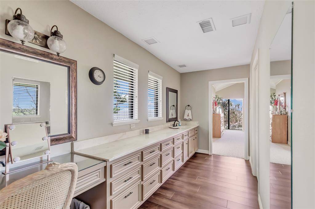 Primary Bath second vanity with tons of storage and built in make up area