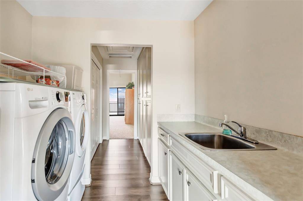 laundry area with sink and additional storage