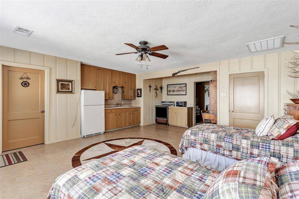 Pool house with a kitchen and full bath and spacious closet