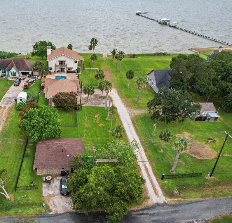Also included in the sale is this rental home in the forefront of the photo.