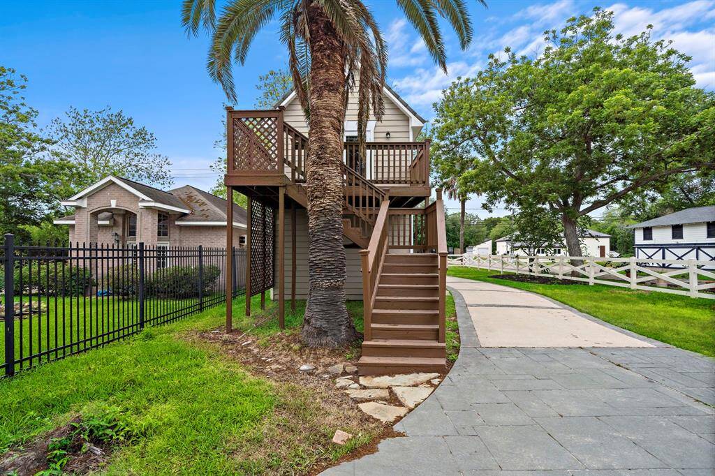 Detached garage building with staircase going to the one bedroom apartment on top