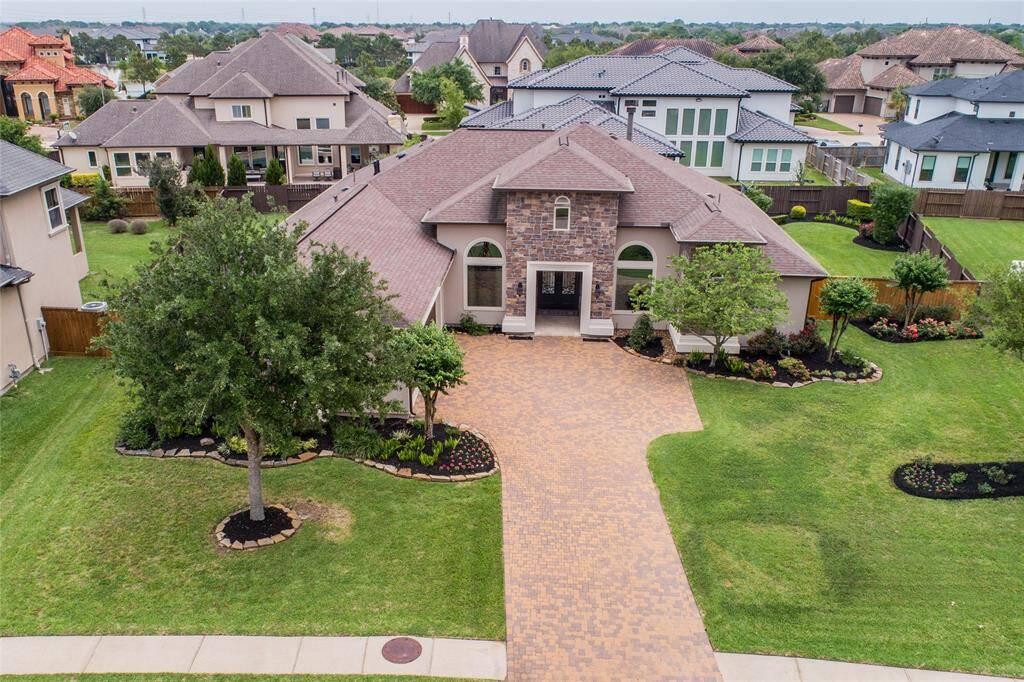 11406 Via Fontana is a beautiful custom home set on a third acre lot. Nestled in the most prestigious area of Lakes of Bella Terra.