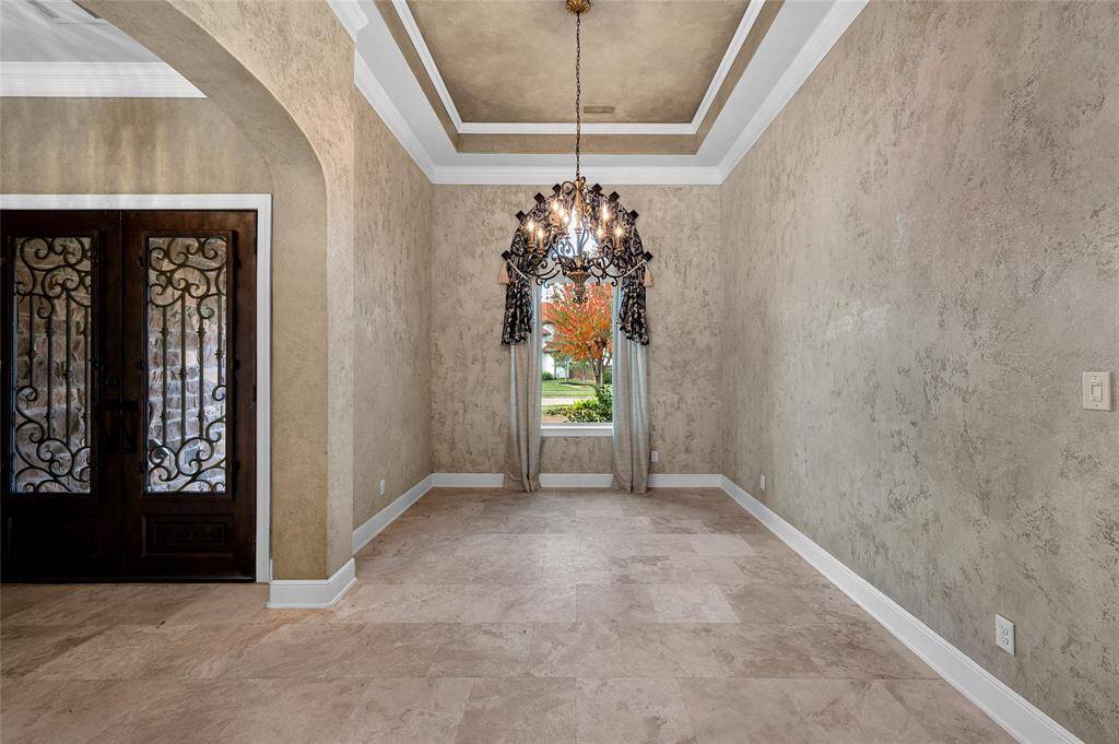 Open to the foyer and formal living area, creating a seamless space for entertaining.