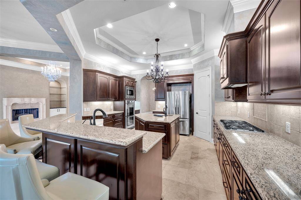 High-end Bosch appliances include dual convection ovens, a 5-burner gas range, dishwasher and microwave.