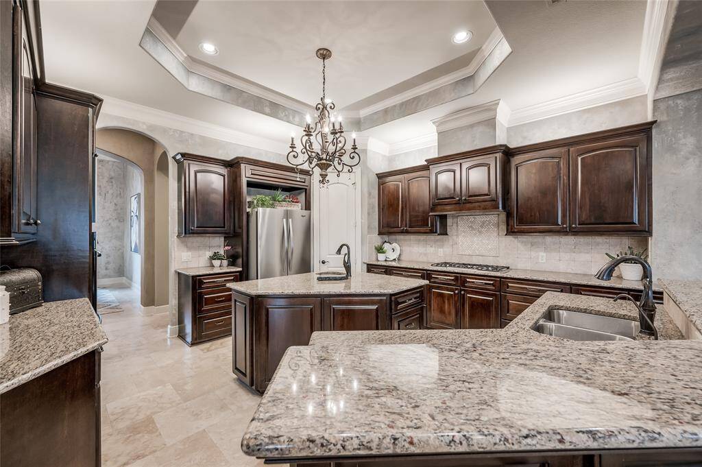 Separate island with prep sink, ample counter space and a walk-in pantry to accommodate your culinary creations.
