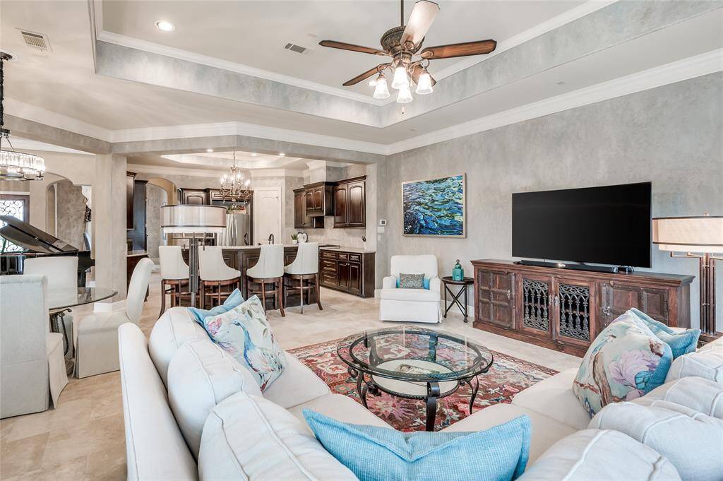 A family room that inspires the perfect balance of luxury and comfort. Beautiful tray ceilings compliment the aesthetics.