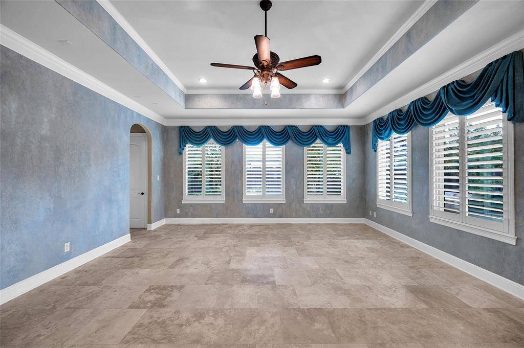 Surrounded by windows which allow natural light to fill the room and offer views of the lushly designed backyard. A spacious family room for entertaining and family gatherings.