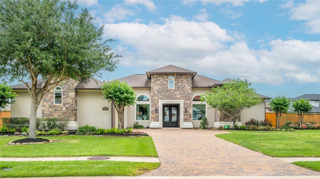 The allure of Tuscan design and understated elegance are captured in this beautiful custom home that sits at the end of a quiet Cul-de-Sac behind private gates.