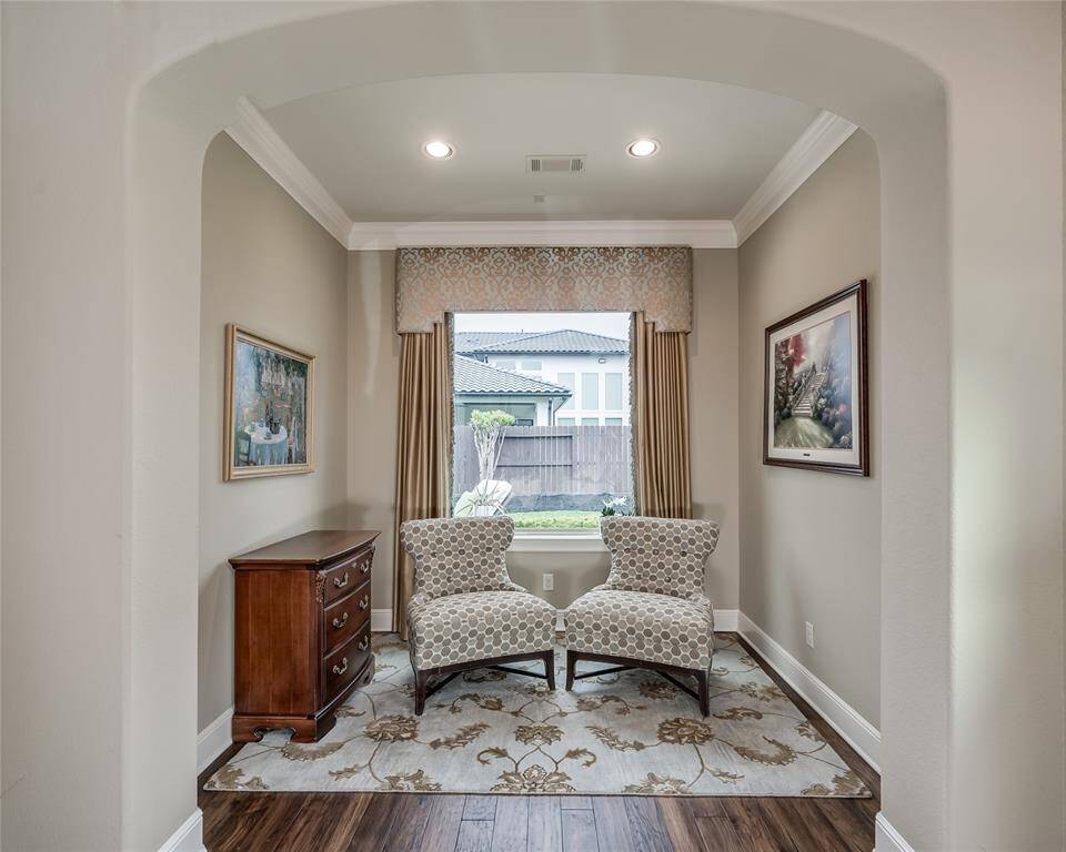 Sitting alcove provides a perfect nook for reading with natural light from the picturesque window.