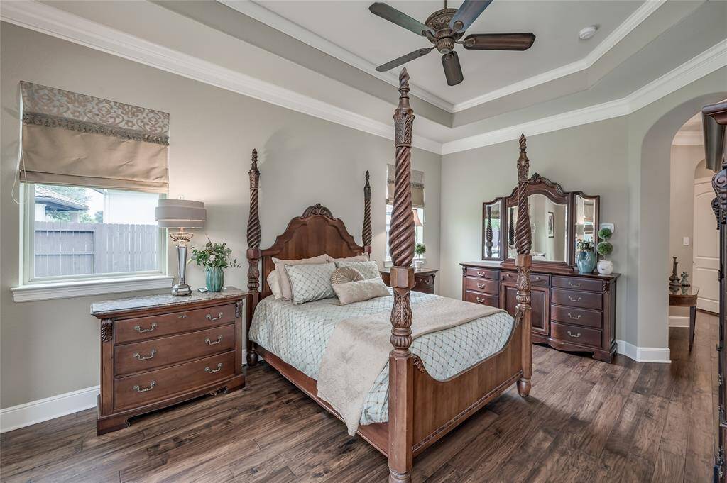 Adorned with custom draperies, the large windows allow soft natural light to fill the room.