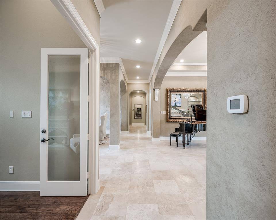 A view from the owner's suite vestibule looks back to the main area of the home. The private study is located just to the left and a wine bar awaits down the hall.