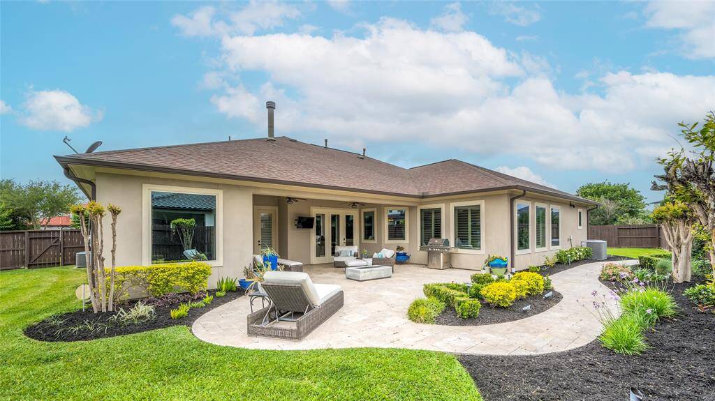 The alluring backyard is a private retreat that is equally as spectacular and luxurious.