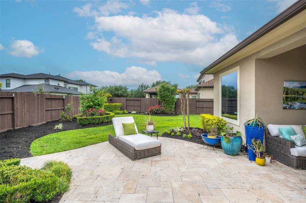 Lushly designed landscaping with accent lighting to accentuate the stunning beauty.