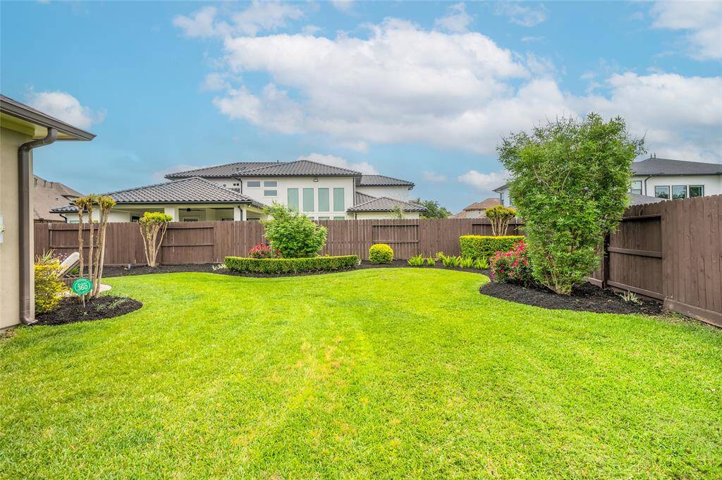 The home boasts a lush third-acre lot adorned with beautiful landscaping, ample space for outdoor living and huge side yards on both sides of home. Renderings available for pool design upon request.