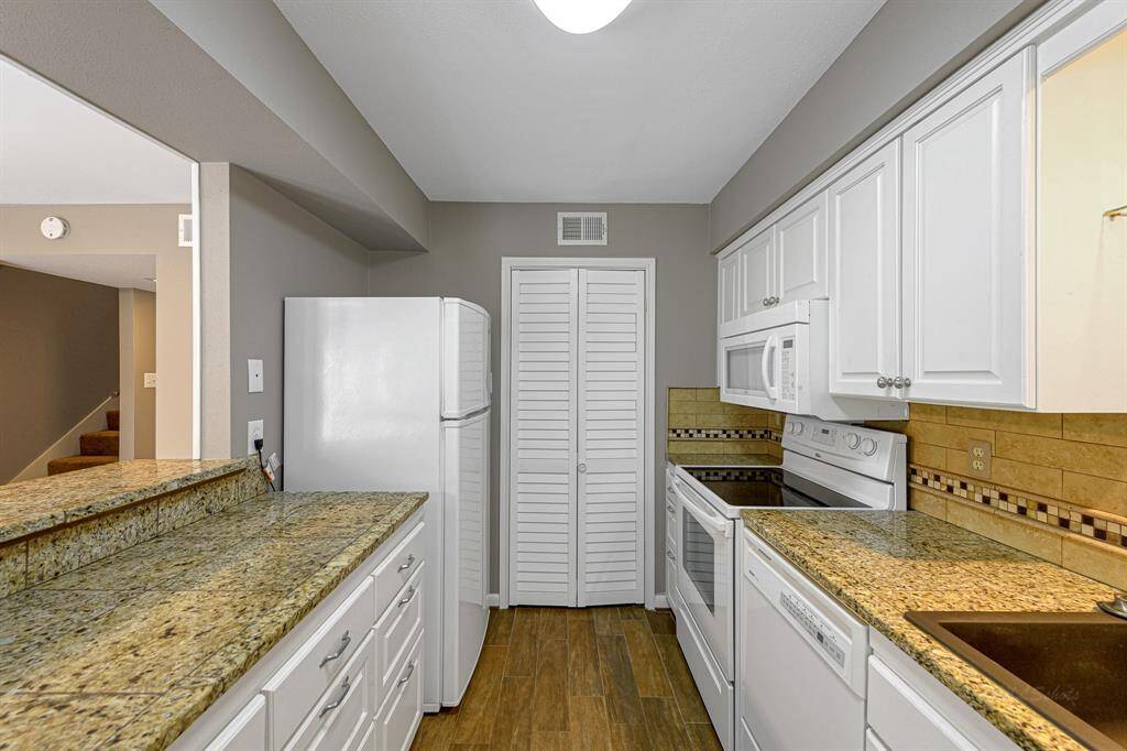 Plenty of cabinets and counter space. Fridge included.