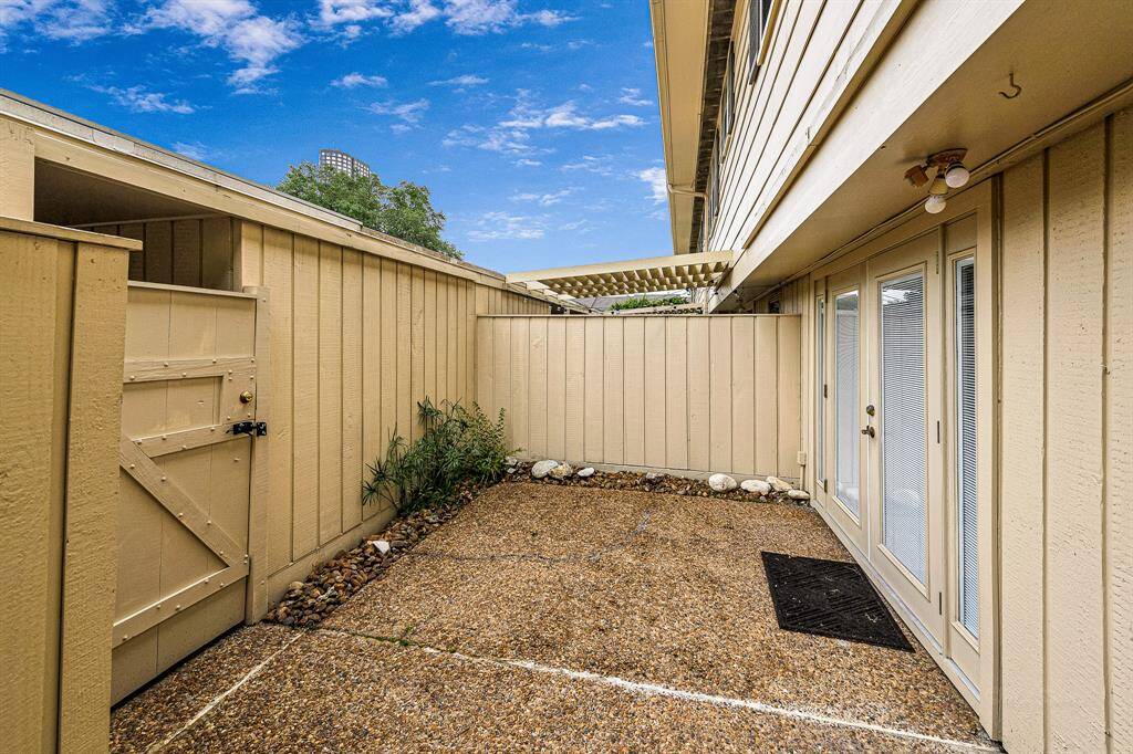 Quaint fenced in patio area
