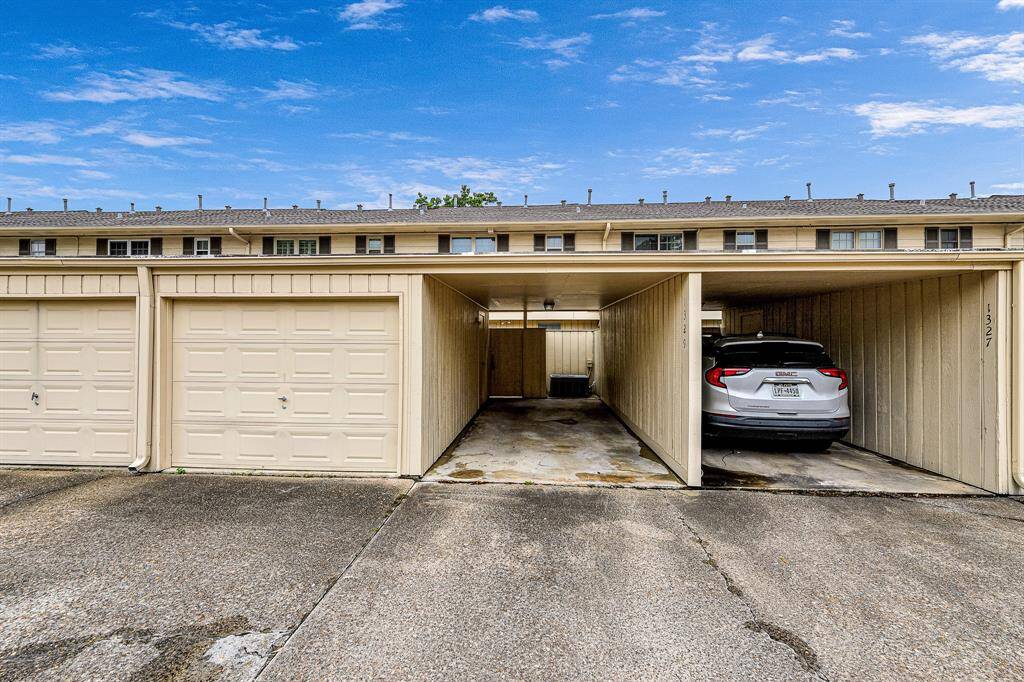 Unit offers enclosed one car garage and one covered carport