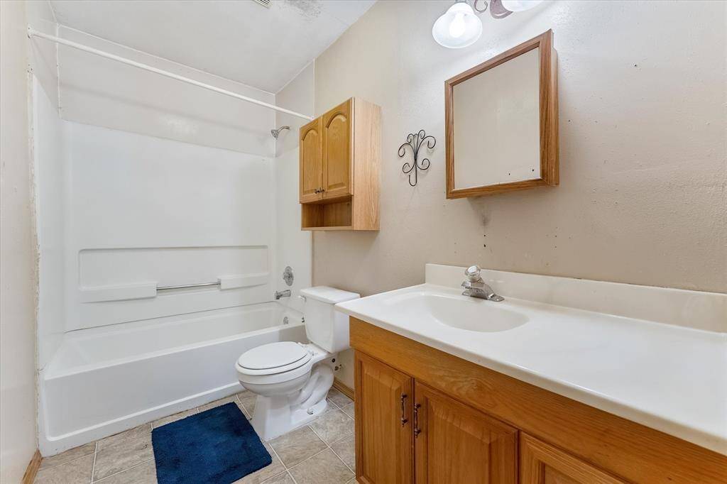 Upstairs bath. Photo virtually staged.