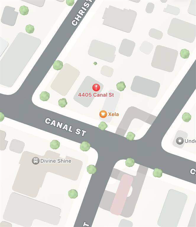 This is a map view of a property located at 4405 Canal St, situated on a main thoroughfare with nearby amenities including a business named Xela and a place called Divine Shine. The area appears to have a mix of residential and commercial properties with green spaces indicated by tree icons.