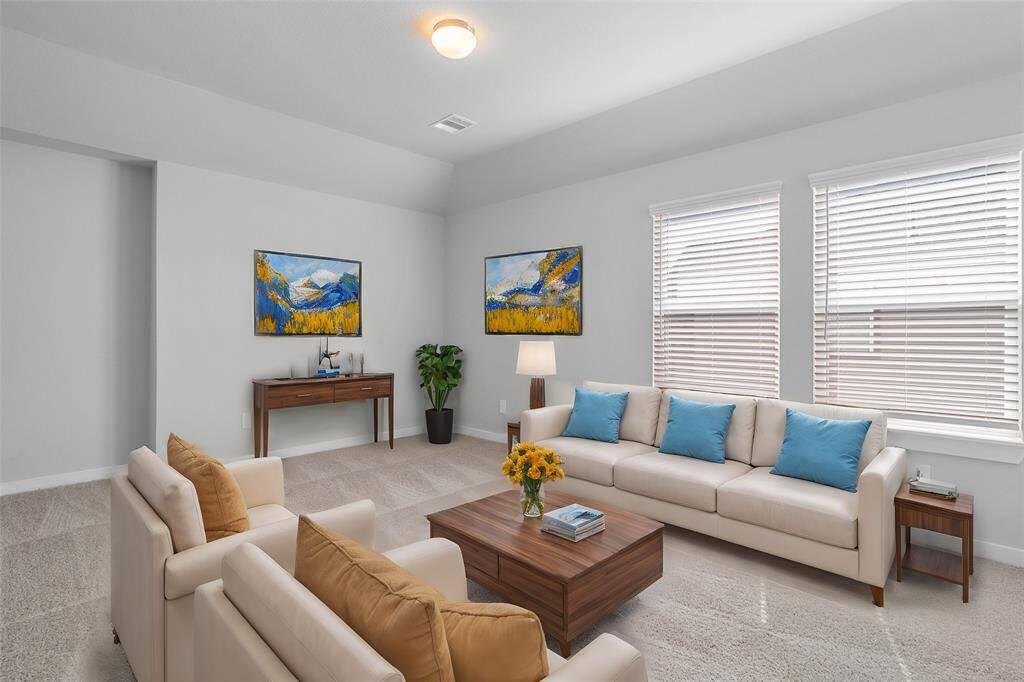 Come upstairs and enjoy a day of leisure in this fabulous game room! This is the perfect hangout spot or adult game room, this space features plush carpet, high vaulted ceiling, lighting, large windows w/privacy blinds, and neutral paint.