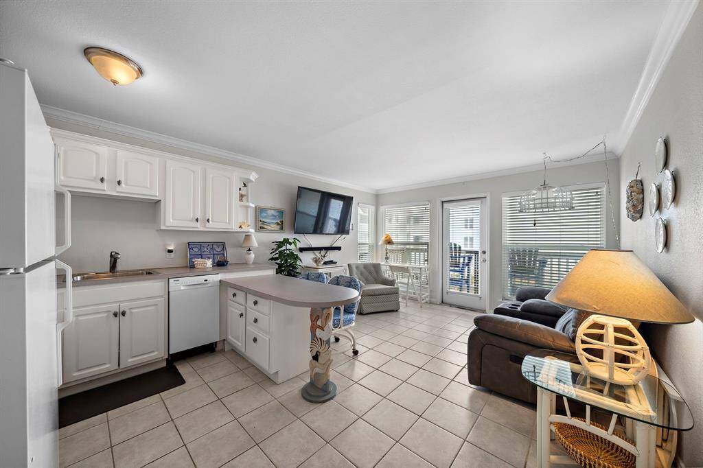 Alternate views of open living room and kitchen area