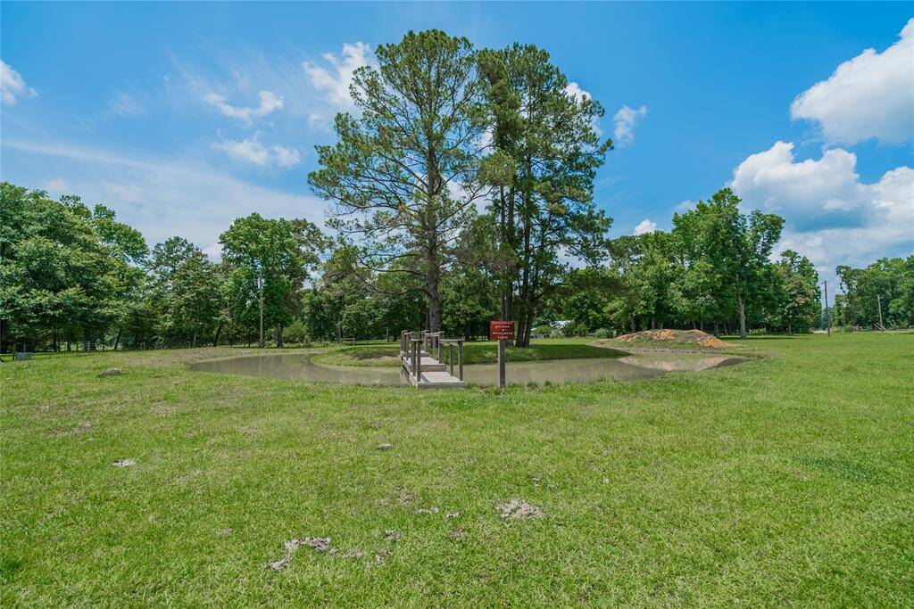 I loved this feature of the property. A pond built completely around a group of trees, and a really neat bridge going to the island. The pond is stocked with great fish and is 4' deep on one side, and 8' deep on the other. Your family and friends will have some Great Memories here.