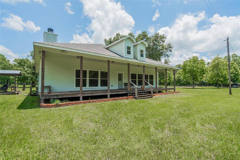 Some other information about the home is that it has 10' ceilings, central air/heat, ceiling fans, and a security system in place. Ceiling beams in the Living Room and Dining Room are decorative, but are made of 6" x 6" Red Oak.
