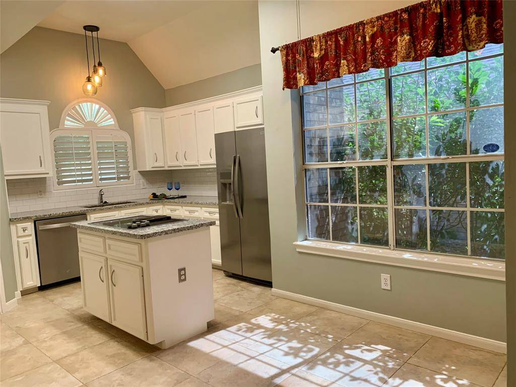 THE BREAKFAST ROOM IS OFF THE KITCHEN