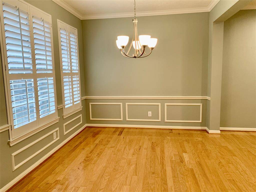 THE DINING ROOM IS OPEN TO THE FAMILY ROOM