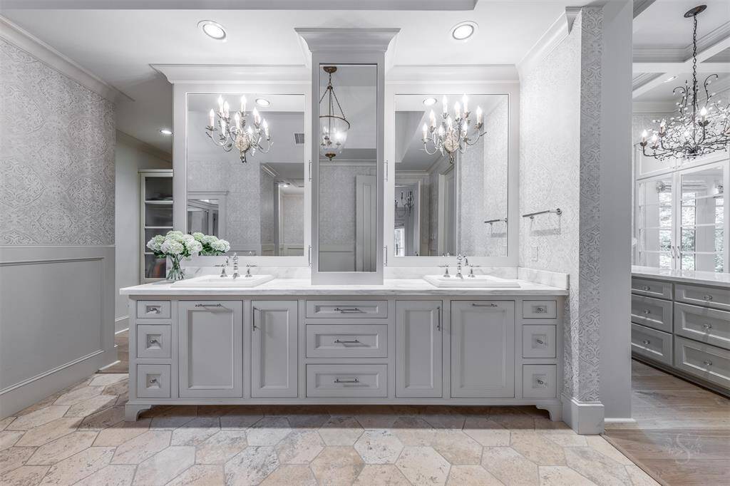 Luxurious finishes make this primary bathroom an elevated experience.