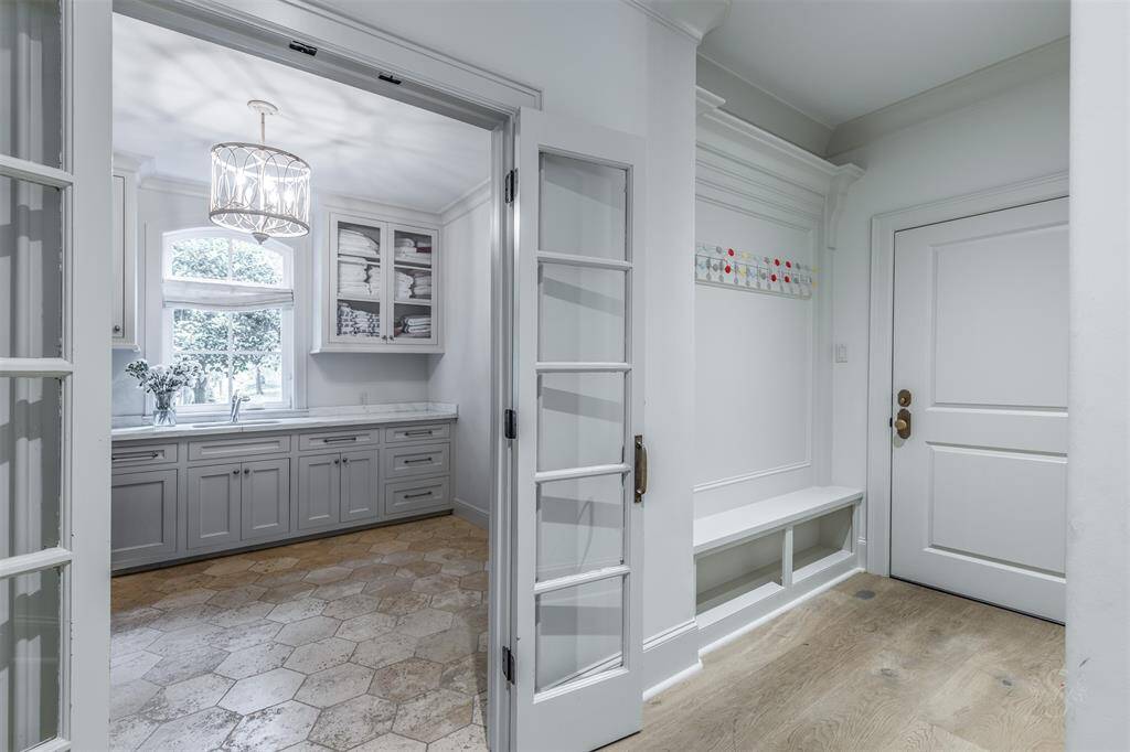 Laundry room is another dream!! Access thru elegant french doors. The 10.9" x 10.6 feet offers a separate closet and space for a second refrigerator that is included.