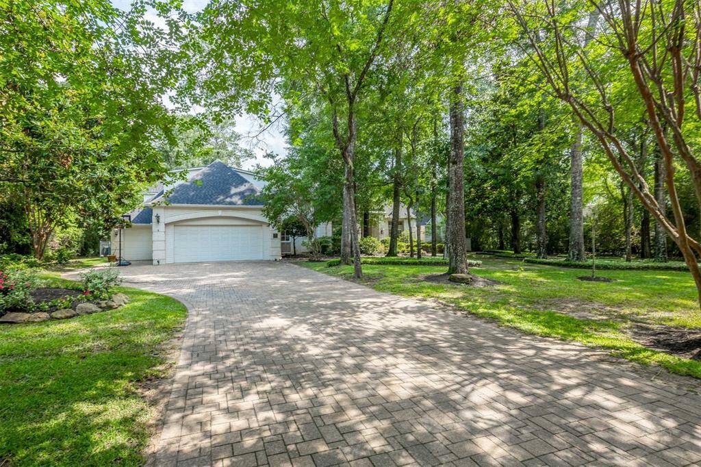 The home sits on a 1/2 acre with mature trees.