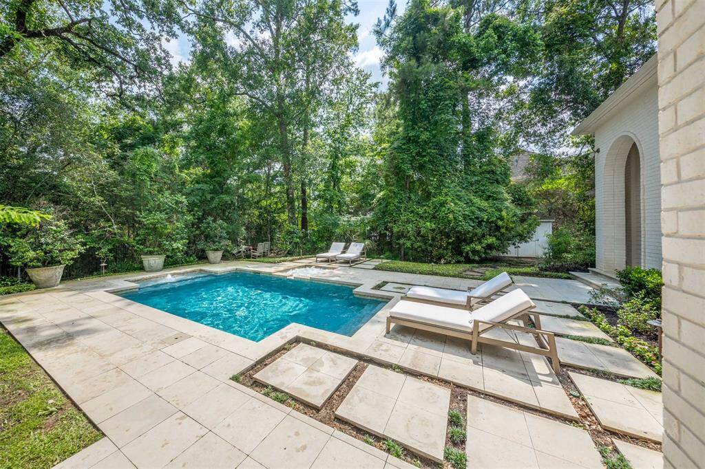 The iron gate offers a door to access Lake Woodlands easily.