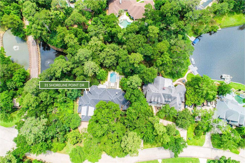 Located on a 1/2 acre, the wooded reserve offers privacy, beautiful views to the pond and access Lake Woodlands thru path