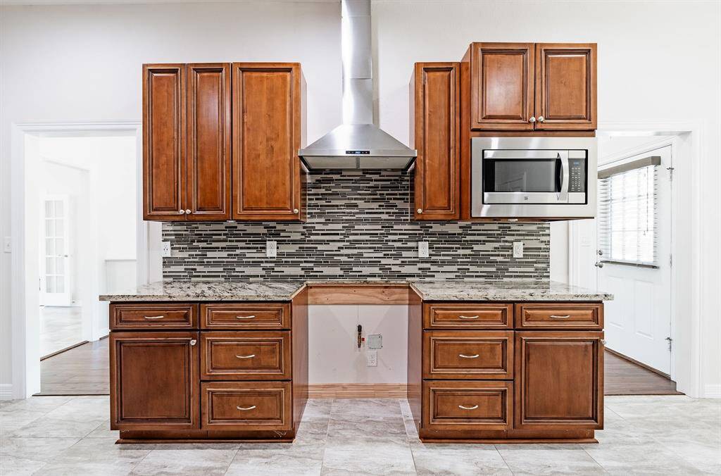 Kitchen (new stove being delivered) with gas stove.